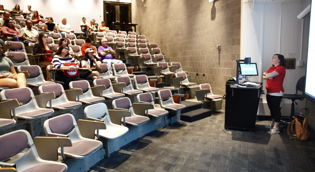 instructor speaking in lecture hall